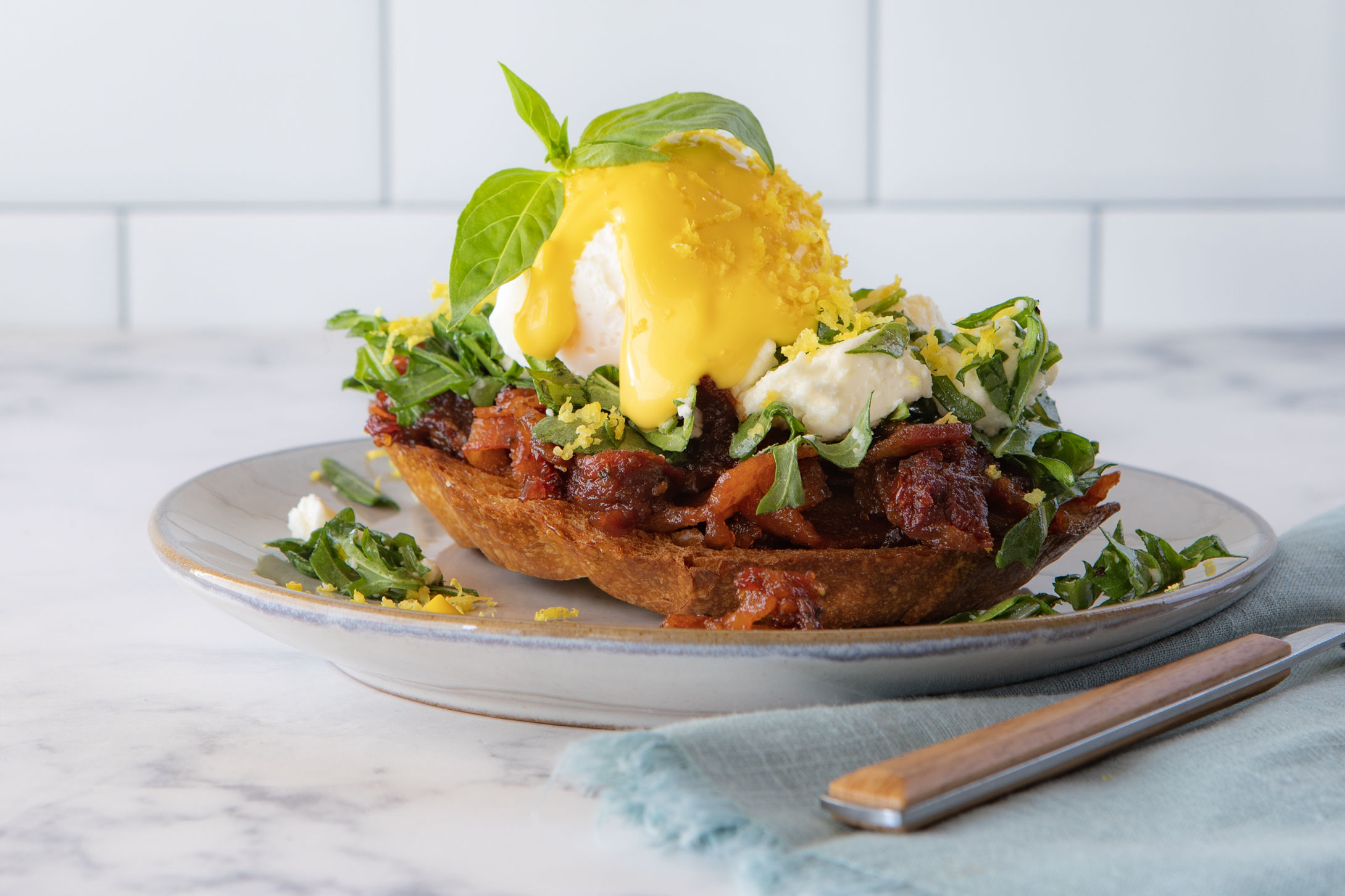 Sun Dried Tomato & Bacon Jam Toast, with Arugula & Feta Salad, Poached Eggs & Citrus Saffron Aioli
