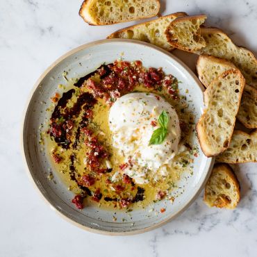 Burrata with Sun Dried Tomatoes and Basil Dipping Oil