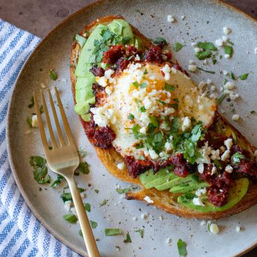 Sun Dried Tomato Chipotle Eggs Over Avocado Toast