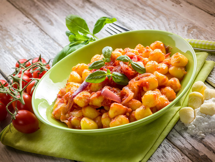 Potato Gnocchi with Sun Dried Tomatoes, Sweet Onions and Basil
